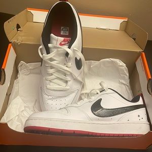 Nike Revolution 5 white black red athletic shoes metallic stars